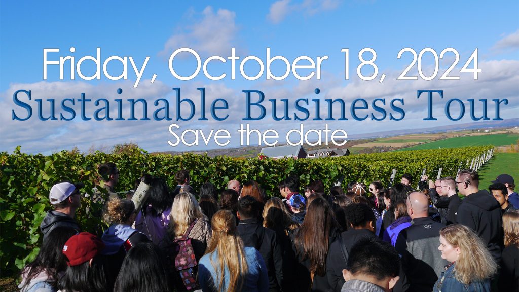 Photo of beautiful fall sky with little white clouds in the background and a group of students listening to a presentation in front of rolling hills of grape vines in the foreground. The text reads Friday October 18 2024. Sustainable Business Tour. Save the date.