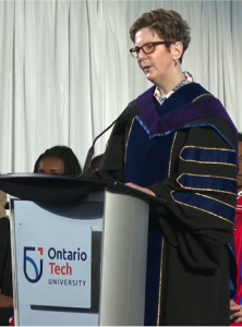 Dr Jacquie Gahagan receiving their honorary Doctor of Laws from Ontario Tech University