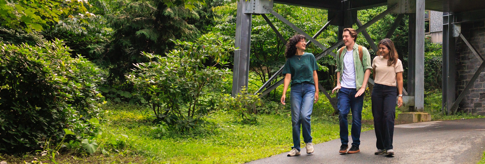 3 MSVU Students walking underneath the link between the Rosaria Student Centre and the McCain Centre