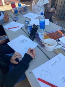 Close up of someone creating Indigenous artwork in the Two Eyed Seeing program