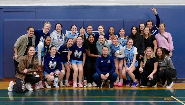 The MSVU 2024/2025 Women's Basketball Team, with Coach Mark Forward in the middle