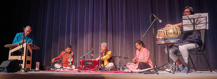 Ashwani Kumar and his band performing Indian Classic music on stage