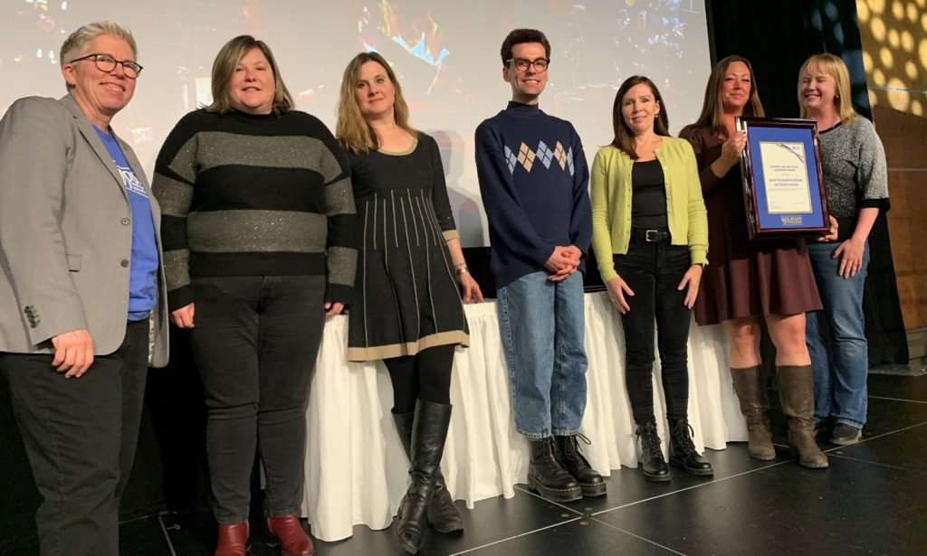 Jessica Ferguson, of the Centre of Academic Advising and Student Success, holding the Diversity and Inclusion Leadership Award