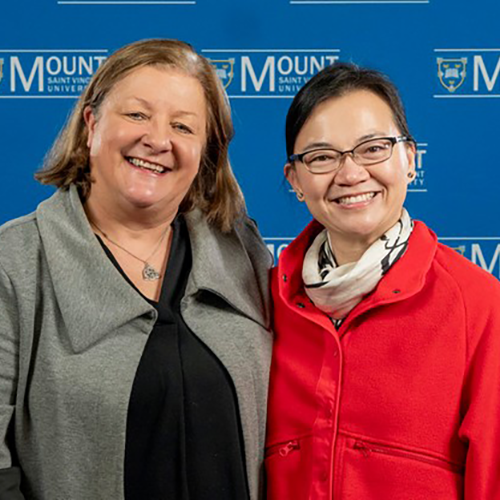 Dr. Janice Keefe and graduate student Lanlan Xin in front of an MSVU backdrop