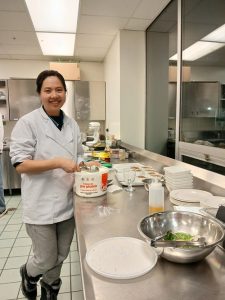 A student working in Vincent's Kitchen on campus