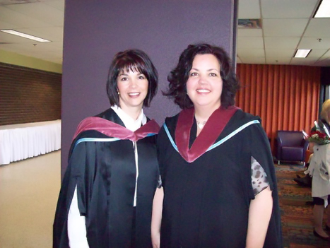 Robyn and Heather at Convocation, wearing their Public Relation gowns