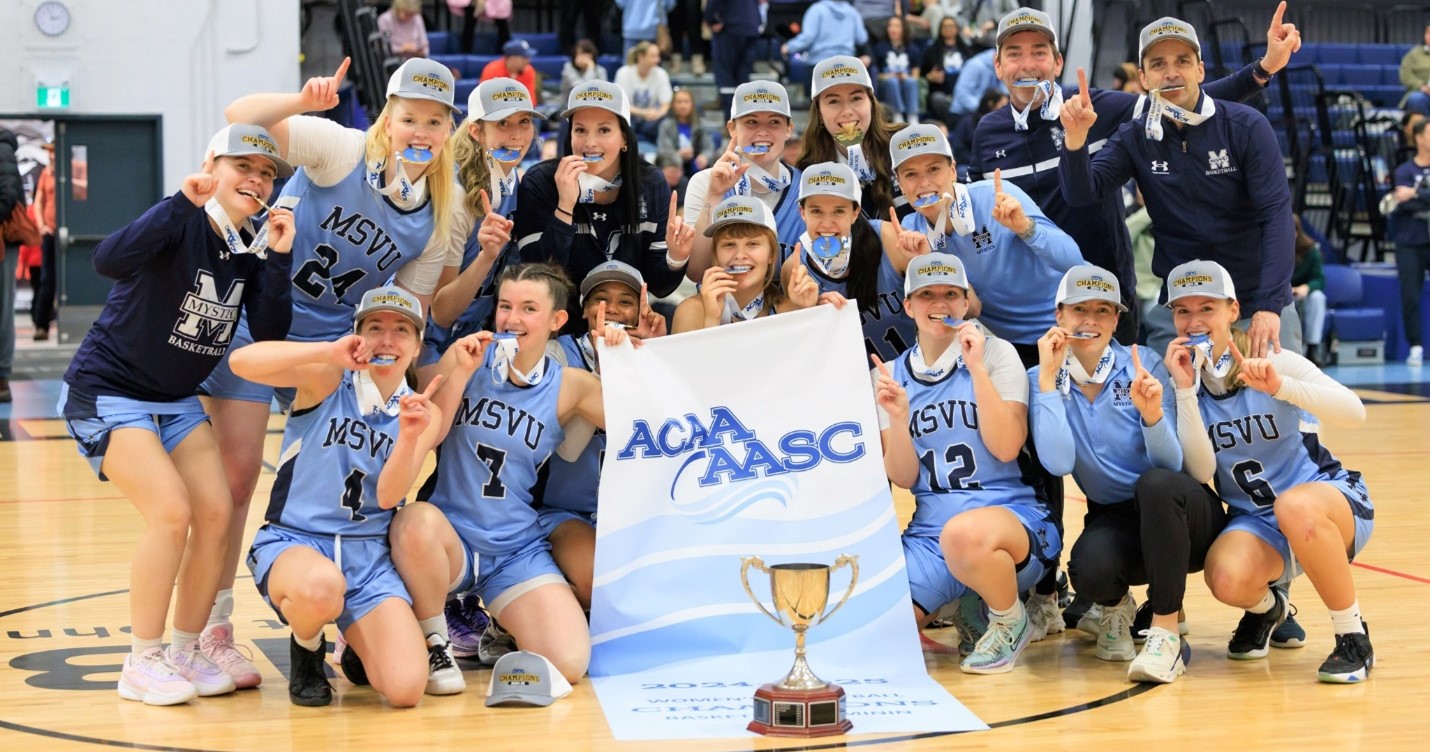 MSVU Mystics Women’s Basketball team holding the Atlantic Collegiate Athletic Association championship trophy